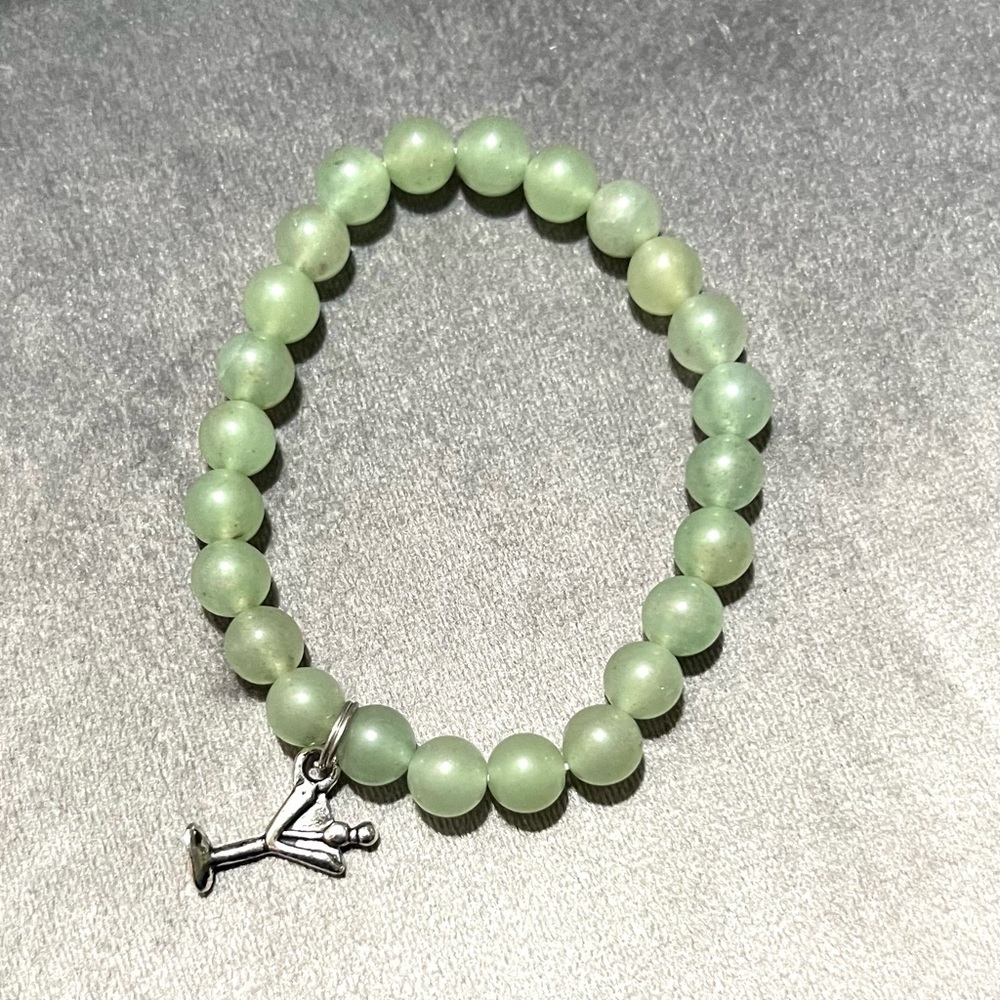 Green beaded stretch bracelet and martini charm